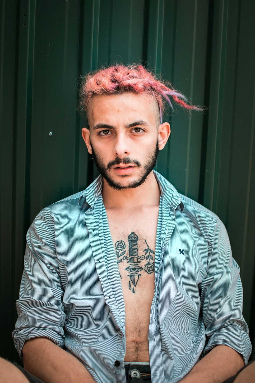 Portrait of a man with a light beard wearing a shirt